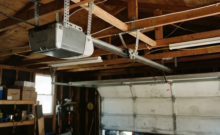 Belt-drive garage door opener mounted to garage ceiling joists